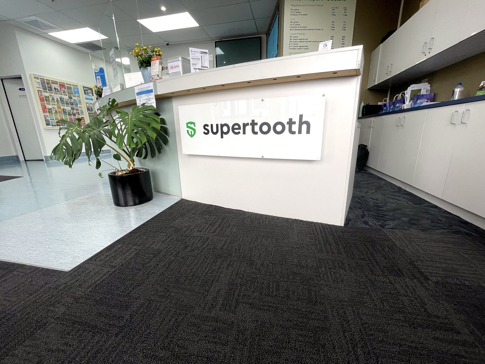The Supertooth reception desk inside the Auckland Airport Shopping Centre, where the team welcomes you