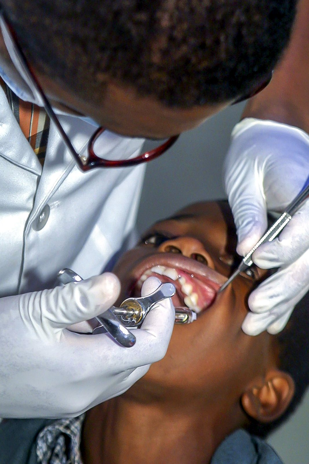 A dentist carrying out careful dental work