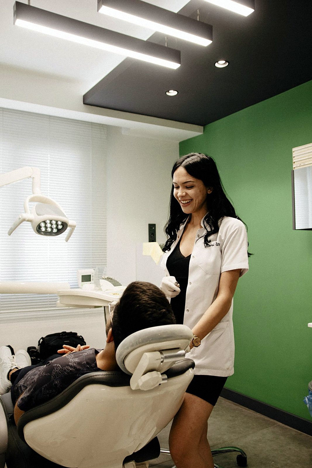 A dentist treating a patient in a modern surgery